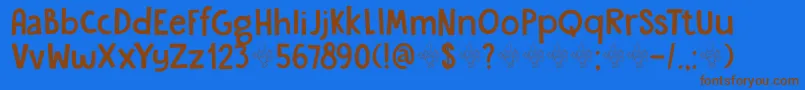フォントDkGardenGnome – 茶色の文字が青い背景にあります。