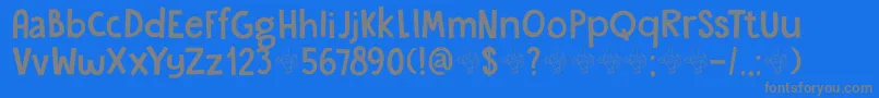 フォントDkGardenGnome – 青い背景に灰色の文字