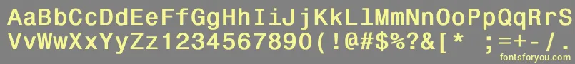 Monospace821Bold-fontti – keltaiset fontit harmaalla taustalla