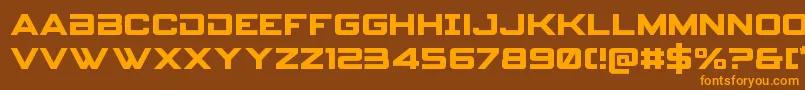 フォントSpyagencyv3 – オレンジ色の文字が茶色の背景にあります。