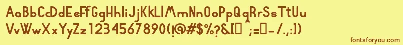 フォントRhyder – 茶色の文字が黄色の背景にあります。