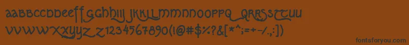 フォントKipferln07 – 黒い文字が茶色の背景にあります