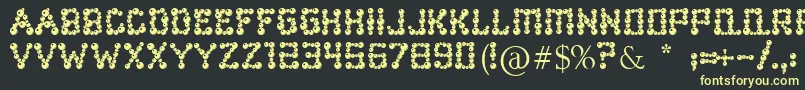 Ballbearings Font – Yellow Fonts on Black Background