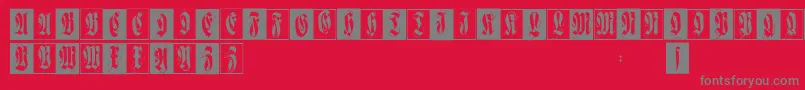 フォントFlourishfraxcaps – 赤い背景に灰色の文字