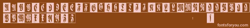 Flourishfraxcaps-fontti – vaaleanpunaiset fontit ruskealla taustalla