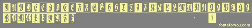Flourishfraxcaps-fontti – keltaiset fontit harmaalla taustalla
