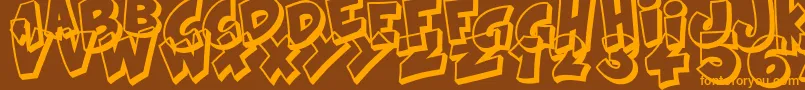 フォントKraash – オレンジ色の文字が茶色の背景にあります。
