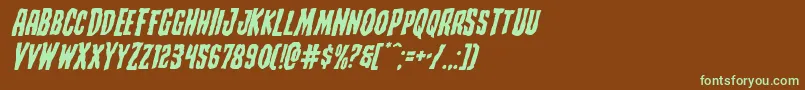 フォントCreepycrawlersexpandital – 緑色の文字が茶色の背景にあります。