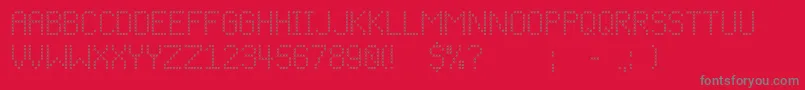 Cfchristmasstitchregular-fontti – harmaat kirjasimet punaisella taustalla