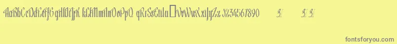 Lageni-fontti – harmaat kirjasimet keltaisella taustalla