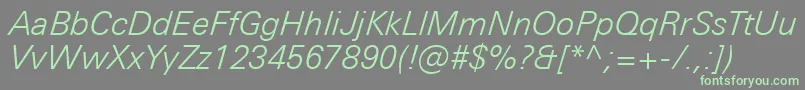 フォントUniversNextProLightItalic – 灰色の背景に緑のフォント
