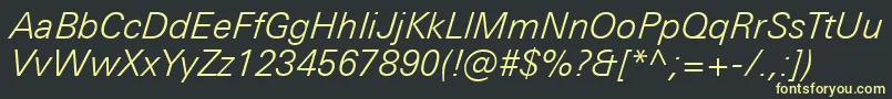 フォントUniversNextProLightItalic – 黒い背景に黄色の文字