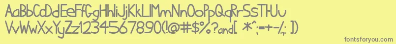フォントIhatcs ffy – 黄色の背景に灰色の文字