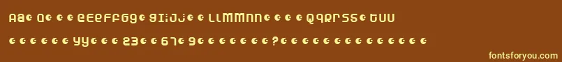 DunebugAlternates-fontti – keltaiset fontit ruskealla taustalla
