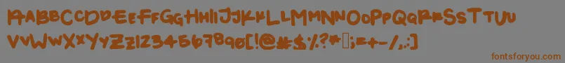 フォントKayla1 – 茶色の文字が灰色の背景にあります。