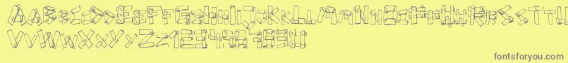 FePlanks-fontti – harmaat kirjasimet keltaisella taustalla