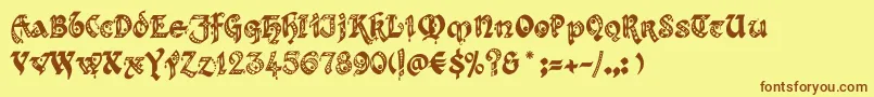 フォントKingthingsgothique – 茶色の文字が黄色の背景にあります。