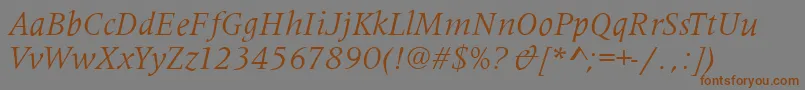 フォントMetaphorItalic – 茶色の文字が灰色の背景にあります。