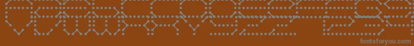 フォントQzTeletype – 茶色の背景に灰色の文字