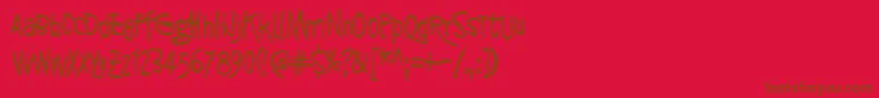 SyntinenIhminenOnKaunisIhminen Font – Brown Fonts on Red Background
