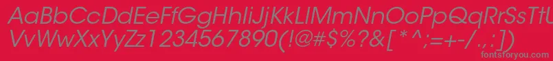 ItcavantgardestdBkobl-Schriftart – Graue Schriften auf rotem Hintergrund