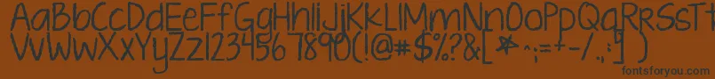 Kgtenthousandreasons Font – Black Fonts on Brown Background