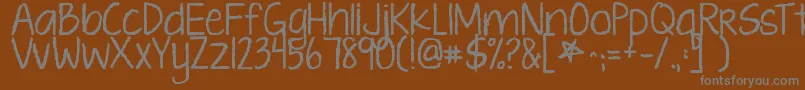 フォントKgtenthousandreasons – 茶色の背景に灰色の文字