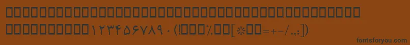 フォントBRoya – 黒い文字が茶色の背景にあります