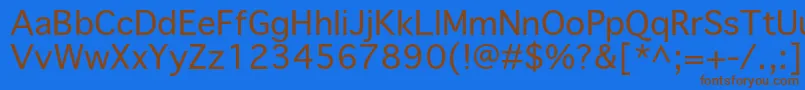 フォントPriamojpropc – 茶色の文字が青い背景にあります。