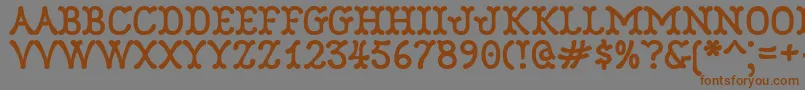 フォントRobinne – 茶色の文字が灰色の背景にあります。