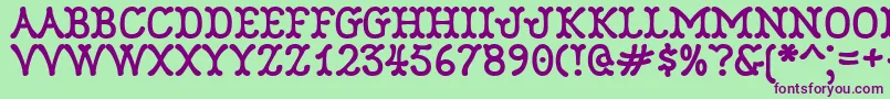 Robinne Font – Purple Fonts on Green Background