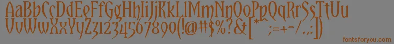 YataghanRegular-Schriftart – Braune Schriften auf grauem Hintergrund