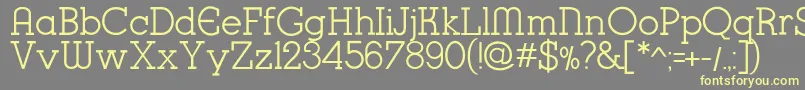 K22KarnakDeco-Schriftart – Gelbe Schriften auf grauem Hintergrund