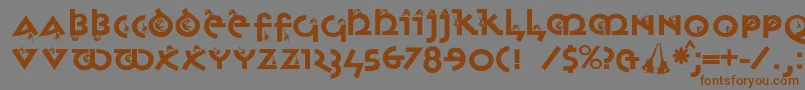 フォントMonkeyuncialica – 茶色の文字が灰色の背景にあります。