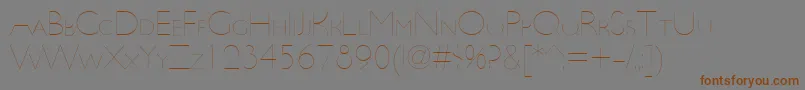 UltimapdbaHairlinesmallcap-Schriftart – Braune Schriften auf grauem Hintergrund