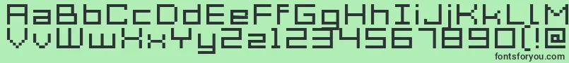 フォントAcme7WideXtnd – 緑の背景に黒い文字