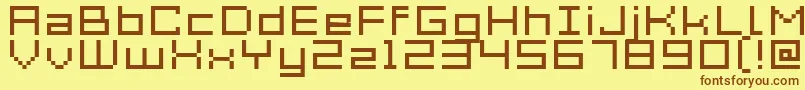 フォントAcme7WideXtnd – 茶色の文字が黄色の背景にあります。