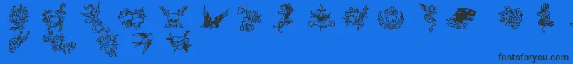 Czcionka TrueManTattoos – czarne czcionki na niebieskim tle