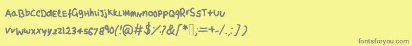 フォントMayaSScript – 黄色の背景に灰色の文字