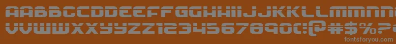 Soldierlaserexpand-Schriftart – Graue Schriften auf braunem Hintergrund