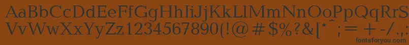 フォントBalticaPlain.001.001 – 黒い文字が茶色の背景にあります