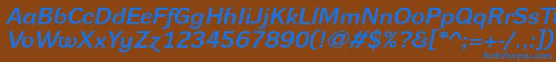 DynagroteskdxeItalic Font – Blue Fonts on Brown Background