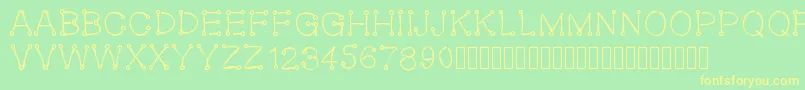 Oeillet-fontti – keltaiset fontit vihreällä taustalla