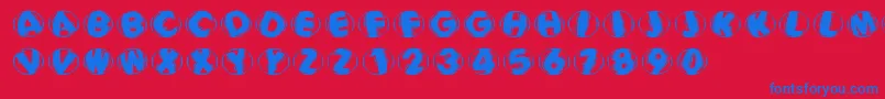 Fonte Woodcuttedcapsblackfs – fontes azuis em um fundo vermelho