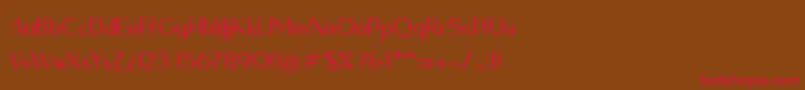 フォントQuesha – 赤い文字が茶色の背景にあります。
