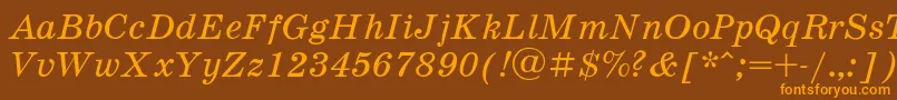 フォントSchooli – オレンジ色の文字が茶色の背景にあります。
