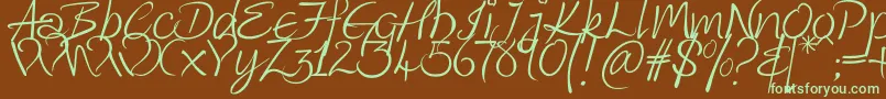 フォントKingthingsWrote – 緑色の文字が茶色の背景にあります。