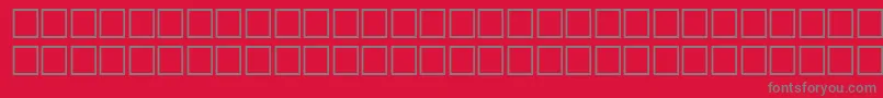 フォントTopicRegular – 赤い背景に灰色の文字