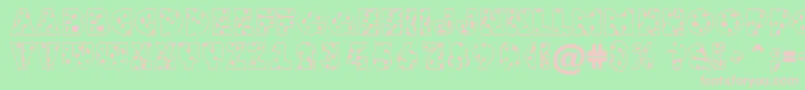GrotosptNormal-fontti – vaaleanpunaiset fontit vihreällä taustalla