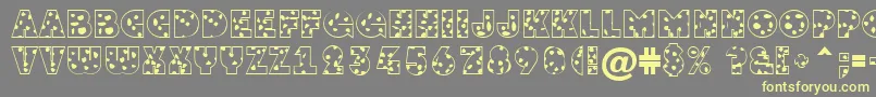 GrotosptNormal-fontti – keltaiset fontit harmaalla taustalla